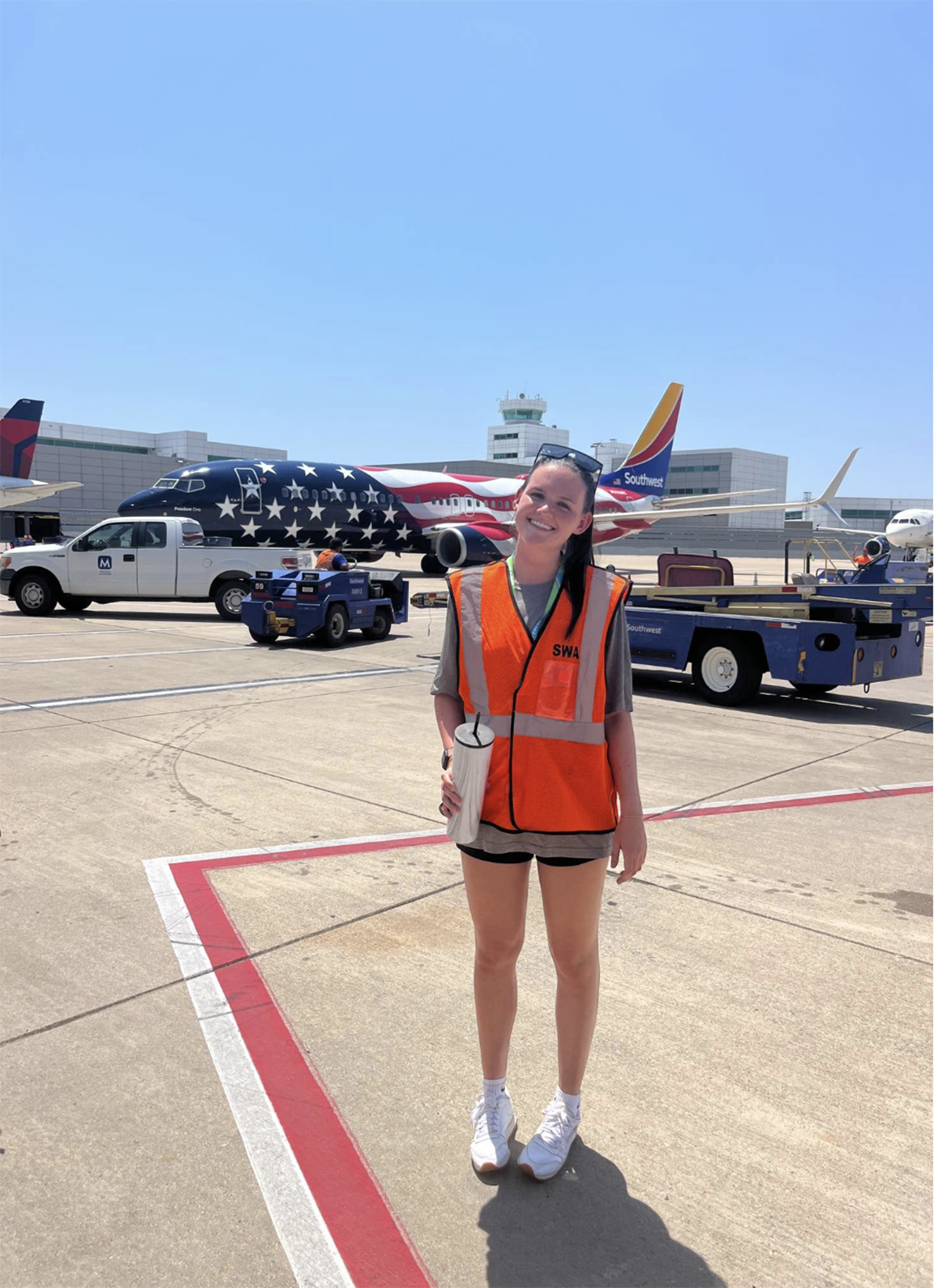 Emily Baldwin stands on the runway at Southwest Airlines headquarters in Dallas, Texas. 