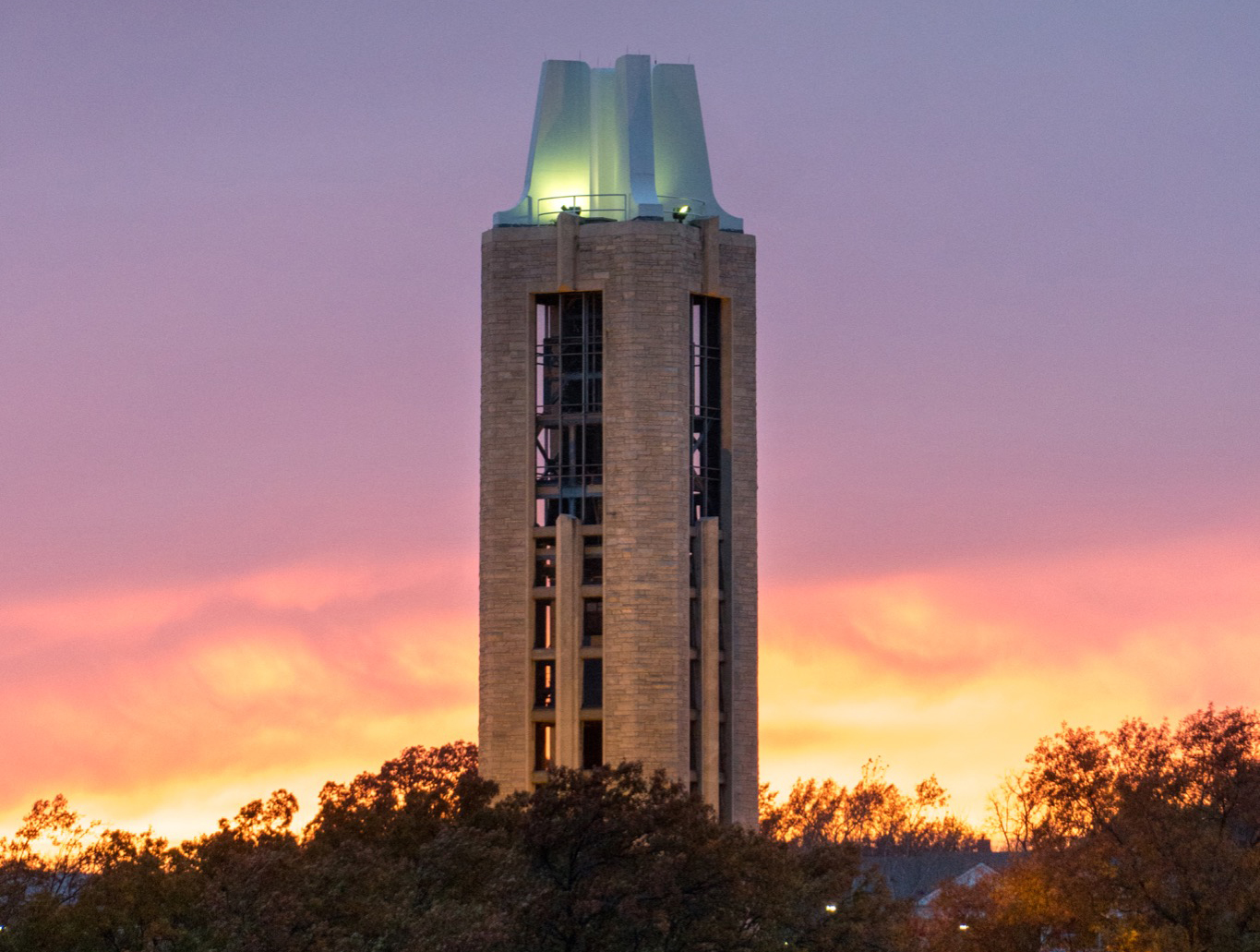 Photo of the KU campanile at sunset