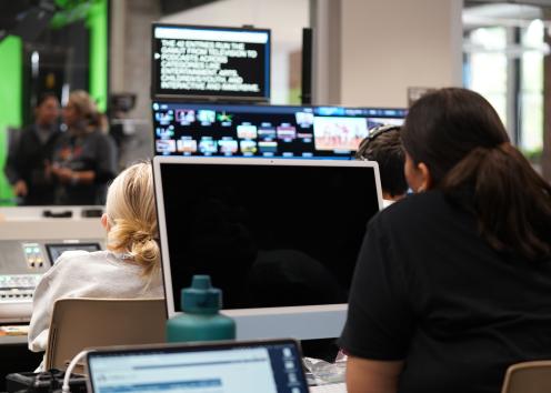 Students work in control room and teleprompter